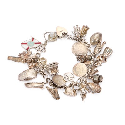 Lot 739 - A SILVER CHARM BRACELET WITH A HEART PADLOCK CLASP