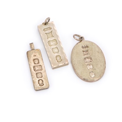 Lot 695 - THREE SILVER INGOT PENDANTS