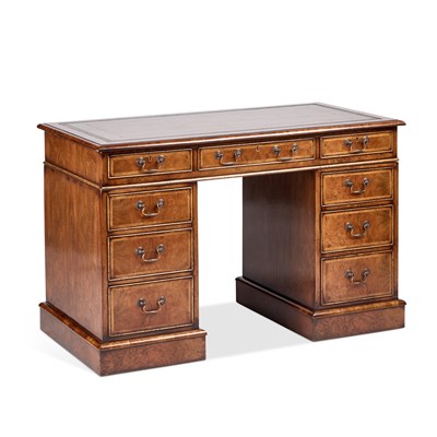 Lot 966 - A GEORGIAN STYLE LEATHER-INSET WALNUT AND FEATHERBANDED PEDESTAL DESK