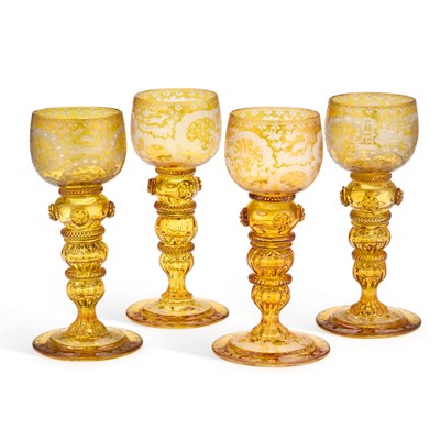 Lot 53 - A SET OF FOUR BOHEMIAN AMBER GLASS HOCK GLASSES
