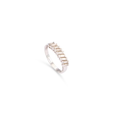 Lot 847 - AN 18 CARAT WHITE GOLD BAGUETTE-CUT DIAMOND HALF HOOP RING