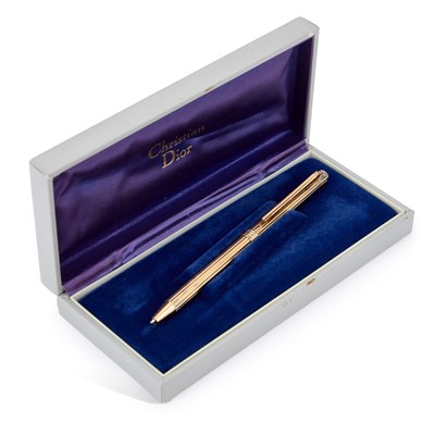 Lot 968 - A CHRISTIAN DIOR SILVER-GILT BALLPOINT PEN