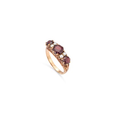 Lot 773 - A 9 CARAT GOLD GARNET AND SEED PEARL RING