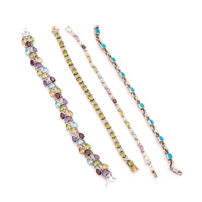 Lot 801 - FOUR SILVER GEM-SET BRACELETS