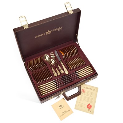 Lot 96 - A BESTECKE SBS SOLINGEN 23/ 24 KARAT HARD GOLD PLATED TWO-TONE CANTEEN OF CUTLERY