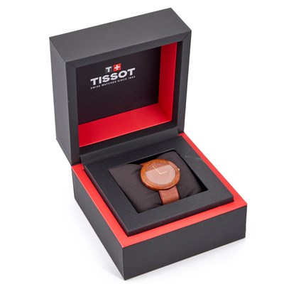Lot 734 - A TISSOT WOOD WATCH