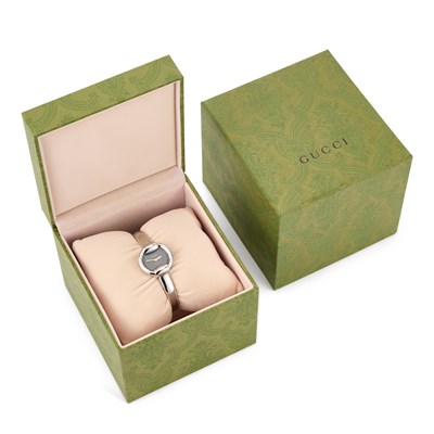 Lot 720 - A LADY'S STEEL GUCCI BANGLE WATCH