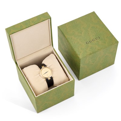 Lot 704 - A GUCCI STRAP WATCH