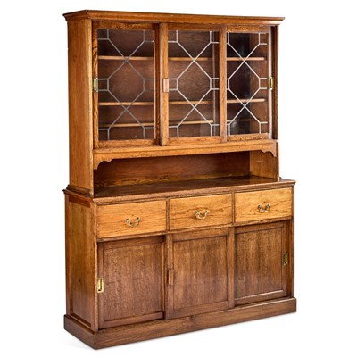 Lot 204 - AN EARLY 20TH CENTURY OAK AND LEAD-GLAZED BOOKCASE CABINET