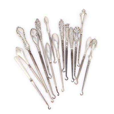 Lot 293 - A COLLECTION OF FIFTEEN SILVER-HANDLED BUTTON HOOKS