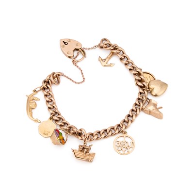 Lot 877 - A 9 CARAT GOLD CURB LINK CHARM BRACELET