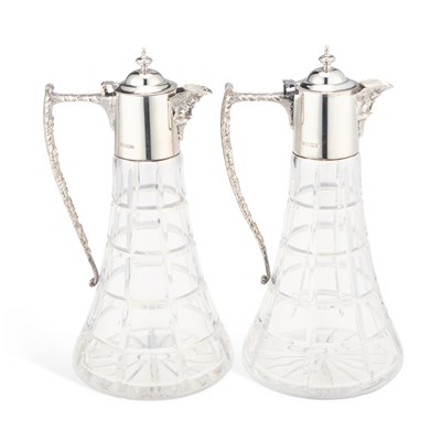 Lot 257 - A PAIR OF ELIZABETH II SILVER-MOUNTED CUT-GLASS CLARET JUGS