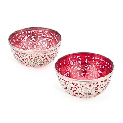 Lot 175 - A PAIR OF CHINESE SILVER BOWLS WITH RUBY GLASS LINERS