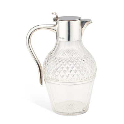 Lot 396 - A GEORGE V SILVER-MOUNTED GLASS CLARET JUG