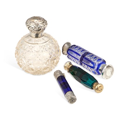 Lot 462 - A GROUP OF VICTORIAN SILVER-TOPPED SCENT BOTTLES