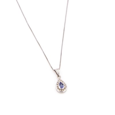 Lot 886 - A TANZANITE AND DIAMOND PENDANT ON CHAIN