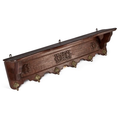 Lot 1128 - A CARVED OAK WALL-MOUNTED HANGING RACK