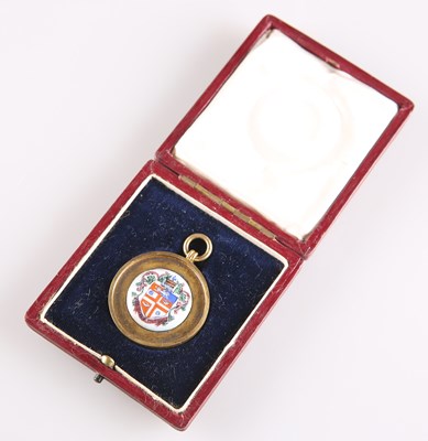 Lot 314 - A GEORGE V SILVER-GILT AND ENAMEL 'HARROGATE' FOB MEDALLION