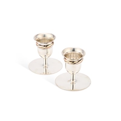 Lot 396 - A PAIR OF CARTIER STERLING SILVER CANDLESTICKS