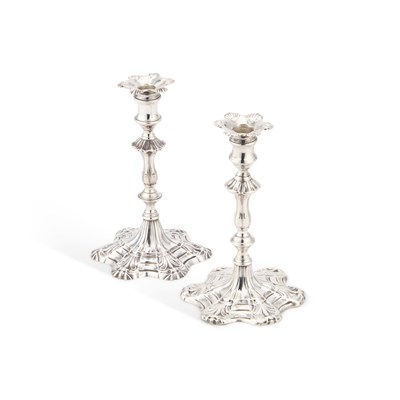 Lot 585 - A MATCHED PAIR OF GEORGE III CAST SILVER TAPERSTICKS