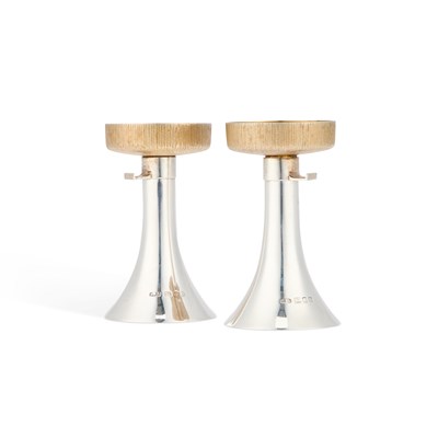 Lot 443 - A PAIR OF ELIZABETH II PARCEL-GILT SILVER CANDLESTICKS