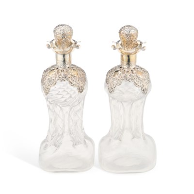 Lot 324 - A PAIR OF SMALL EDWARDIAN SILVER-MOUNTED GLUG-GLUG JUGS