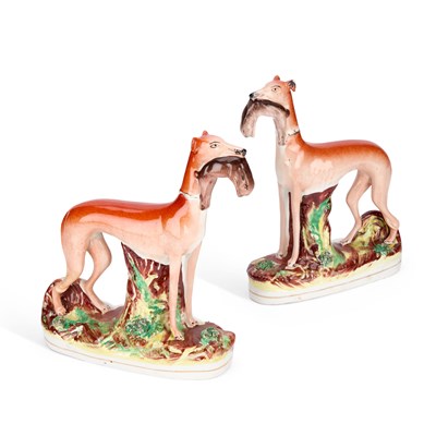 Lot 33 - A PAIR OF VICTORIAN STAFFORDSHIRE POTTERY GREYHOUND COURSING FIGURES