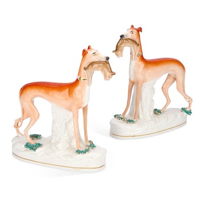 Lot 34 - A PAIR OF VICTORIAN STAFFORDSHIRE POTTERY GREYHOUND COURSING FIGURES
