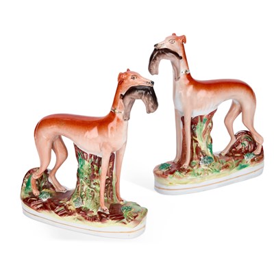 Lot 282 - A PAIR OF VICTORIAN STAFFORDSHIRE POTTERY GREYHOUND COURSING FIGURES