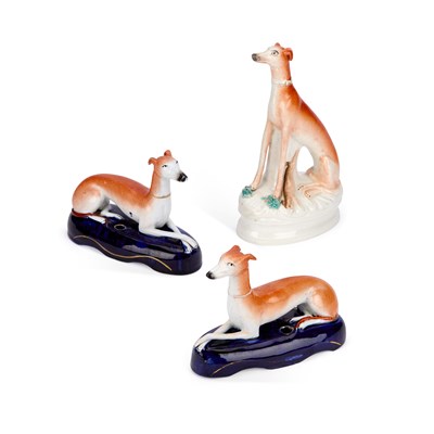 Lot 39 - A PAIR OF VICTORIAN STAFFORDSHIRE POTTERY GREYHOUND PEN STANDS