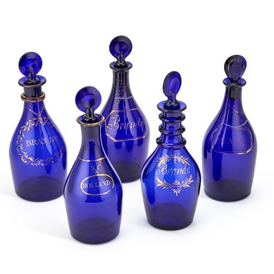 Lot 215 - FIVE GEORGIAN BRISTOL BLUE GLASS DECANTERS AND STOPPERS