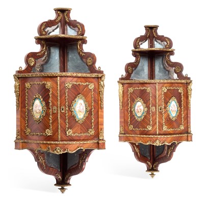 Lot 1152 - A FINE PAIR OF 19TH CENTURY PORCELAIN AND ORMOLU MOUNTED KINGWOOD CORNER CABINETS