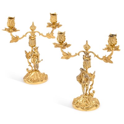 Lot 434 - A PAIR OF ELIZABETH II CAST SILVER-GILT FIGURAL CANDELABRA