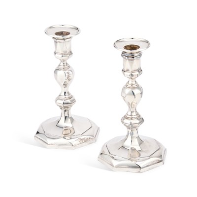 Lot 439 - A PAIR OF ELIZABETH II CAST SILVER CANDLESTICKS