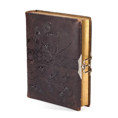 Lot 837 - A LATE VICTORIAN STAMPED LEATHER PHOTOGRAPH ALBUM