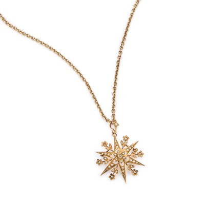 Lot 889 - A VICTORIAN SEED PEARL STAR PENDANT ON A LATER 9 CARAT GOLD CHAIN