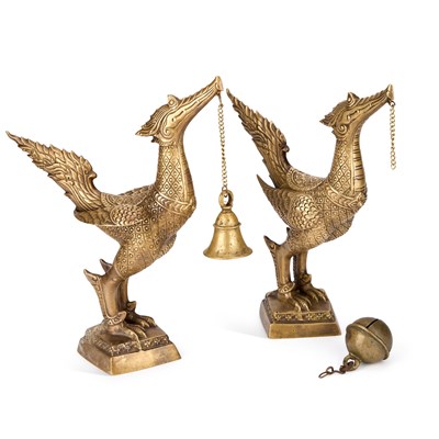 Lot 491 - A PAIR OF THAI BRASS FIGURES OF MYTHICAL BIRDS WITH BELL PENDANTS