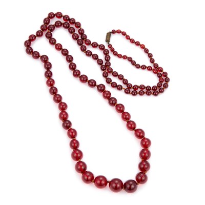 Lot 652 - A GRADUATED CHERRY RED BAKELITE BEAD NECKLACE