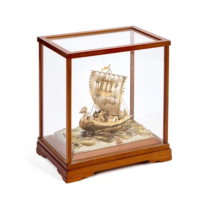Lot 350 - A JAPANESE PARCEL-GILT SILVER MODEL OF A SINGLE-MASTED TREASURE SHIP