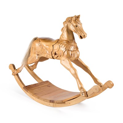 Lot 237 - A CARVED PINE ROCKING HORSE