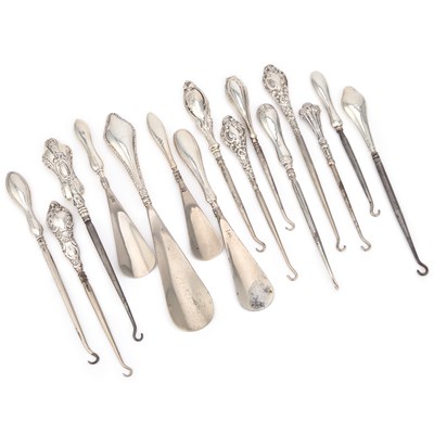 Lot 577 - A COLLECTION OF SILVER-HANDLED BUTTON HOOKS AND SHOE HORNS