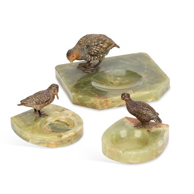 Lot 697 - THREE AUSTRIAN COLD-PAINTED BRONZE AND ONYX ASHTRAYS
