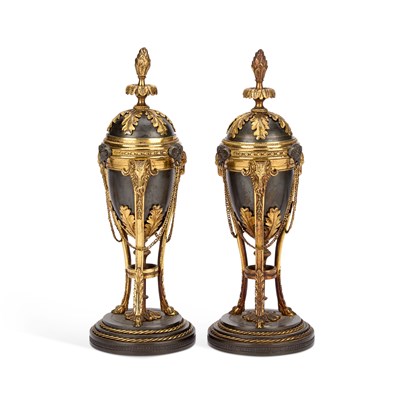 Lot 701 - A PAIR OF LOUIS XVI STYLE PARCEL-GILT BRONZE CASSOLETTES
