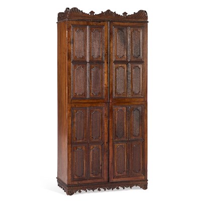 Lot 876 - A CARVED HARDWOOD FOUR-DOOR CUPBOARD
