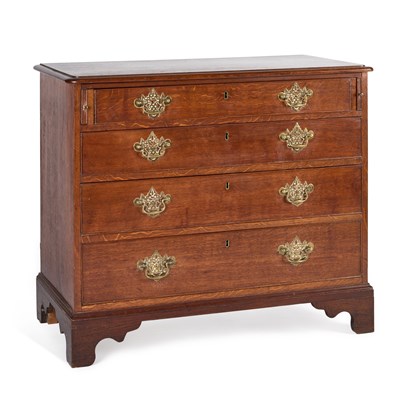 Lot 1004 - AN OAK CHEST OF DRAWERS