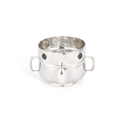 Lot 282 - AN ARTS AND CRAFTS SILVER FOUR-HANDLED BOWL
