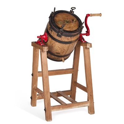Lot 1226 - AN IRON AND OAK BUTTER CHURN
