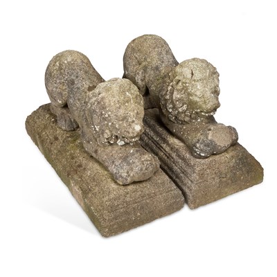 Lot 784 - A PAIR OF WEATHERED COMPOSITE STONE LIONS