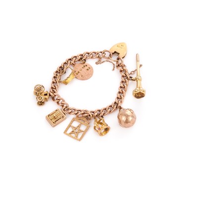 Lot 974 - A 9 CARAT GOLD CURB LINK CHARM BRACELET