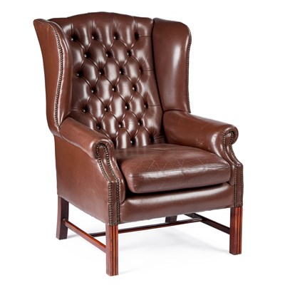 Lot 1047 - A GEORGE III STYLE LEATHER WING ARMCHAIR